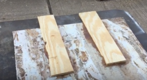 2 Peices of wood adhered to test glass